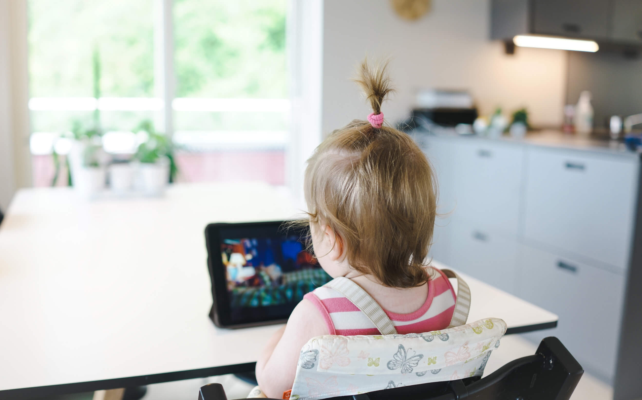 child looking at ipad